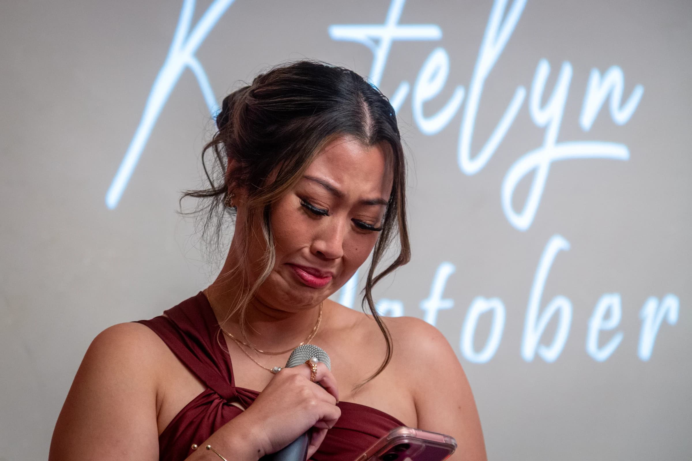 A wedding-party member becomes emotional while delivering a reception speech